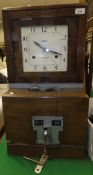 A Blick oak cased clocking in clock,