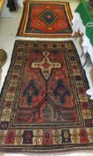 A Persian rug, the tree of life style decoration on a red ground within a cream, red,