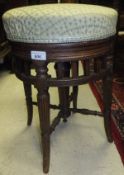 A late 19th Century mahogany framed circular upholstered stool