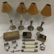 A box containing a set of four Morton's Patent Sheffield plated telescopic candlesticks,