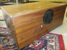 An Oriental teak trunk with large lock