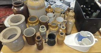 A large collection of stoneware jars and bottles, glass bottles, etc, to include a pair of "A.