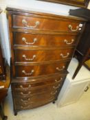 A modern mahogany bow front chest on chest,