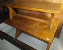 A 20th Century oak settle of wing back tavern style, together with matching bench and trestle end