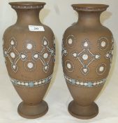 A pair of Royal Doulton silicon china baluster shaped vases, No'd.