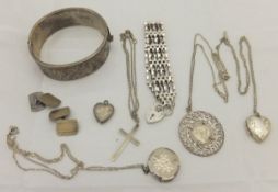 A collection of silver and other white metal jewellery including bracelet, bangle, lockets,