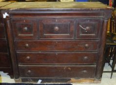 A Victorian mahogany bonnet chest with cushion drawer over three short deep drawers and three long