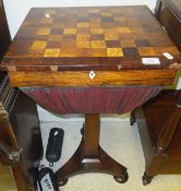 An early Victorian rosewood and inlaid games top sewing table on pedestal tripod base and squat bun