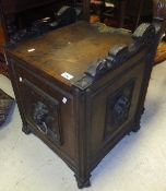 A late Victorian carved oak Gothic Revival coal box with lion mask ring decoration