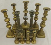 Three pairs of brass candlesticks various, a single candlestick,