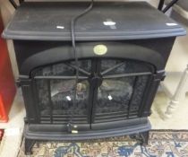 A Berry electric fire as a two door log burner