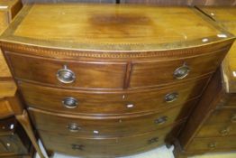 A 19th Century mahogany and inlaid bow fronted chest of two short and three long drawers on bracket