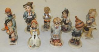 A collection of nine Goebel Hummel figures to include : "Brother", "Little Drummer", "Merry