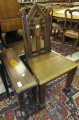 A Victorian oak panel seated hall chair in the Gothic Revival taste and a late 19th Century