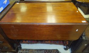A Victorian mahogany drop-leaf Pembroke table with single end drawer on baluster turned and ringed