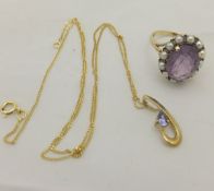 An amethyst and seed pearl set 9 carat gold dress ring and a 9 carat gold and tanzanite pendant and