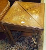 A circa 1900 mahogany and inlaid envelope card table with single drawer on square tapering legs,