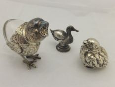 A silver pill box in the form of a bird (Chester, 1905),