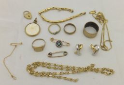 A jewellery box containing various 9 carat gold and other jewellery to include lockets, chains,