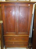 A Victorian mahogany linen press with two cupboard doors above two drawers, on bun feet CONDITION