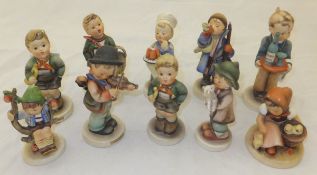 A collection of ten Goebel Hummel figures to include : "Village Boy", "Appletree Boy", "Here Ye Here