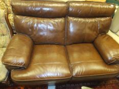 A modern leather two seat reclining sofa