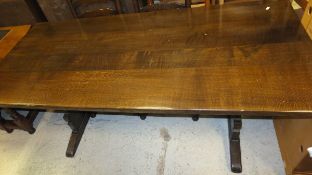A rectangular oak refectory style dining table on trestle end supports CONDITION REPORTS Size approx