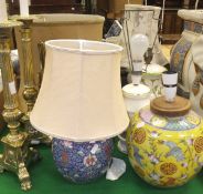 A collection of seven table lamps, together with various shades,