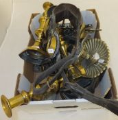 A box containing various brass candlesticks, trivets, martingales, etc CONDITION REPORTS Martingales