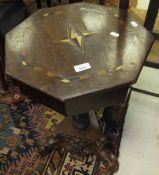 A mahogany and inlaid octagonal work table on associated barley-twist pedestal to carved tripod