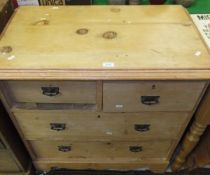 A pine chest of two short and two long drawers on bracket feet