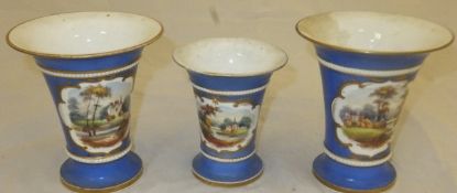 A set of three 19th Century English porcelain trumpet shaped vases,