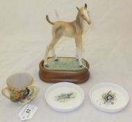 A Royal Worcester figurine "Thoroughbred foal", designed by Doris Lindner and raised on wooden