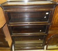 A circa 1900 oak three section Globe Wernicke style bookcase with single drawer below