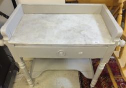 A 19th Century Continental painted pine washstand with three quarter galleried and grey veined