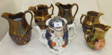 A collection of five late 19th / early 20th Century copper lustre jugs,