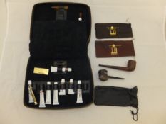 A Dunhill pipe cleaning kit, various pipes, plated butane gas lighter,