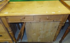 A modern pine side table with two drawers on turned legs, a folding table,