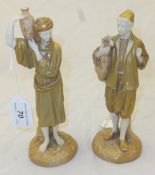 A pair of Royal Worcester blushware figures "Water carriers", No'd. 1206 in puce to base CONDITION