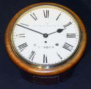 A mahogany cased wall dial with circular face with Roman numerals inscribed "Jas Shoolbred & Co