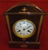 A mahogany and inlaid dome top mantel clock,