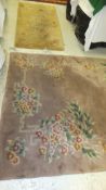 A Chinese superwash rug, the mushroom ground with bamboo and floral decorated borders, in green,