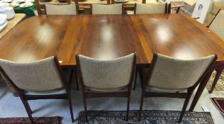 A Danish rosewood dining suite including rounded rectangular dining table on tapered supports, 210
