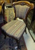 A set of four Victorian mahogany framed dining chairs with upholstered backs and seats,