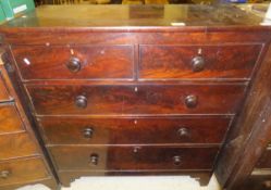 A Victorian mahogany chest of two short and three long graduated drawers with turned knob handles