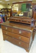 An Edwardian mahogany and satinwood banded dressing chest with mirrored superstructure over two