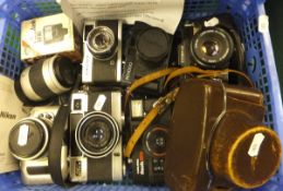 A collection of various vintage SLR and rangefinder cameras, including Olympus Trip, Nikon Pronea,
