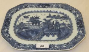 A 19th Century Chinese porcelain platter decorated with buildings and figures in a landscape