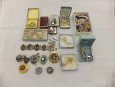 A collection of costume jewellery to include an agate set bracelet,
