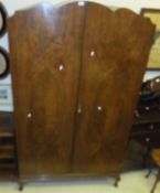 A mid 20th Century walnut two door wardrobe with fitted interior